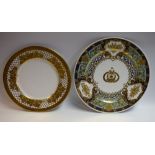 A De Lamerie circular plate, decorated with a border of raised, tooled gilding,