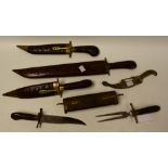 An East Indian carved wood and brass footed two piece carving set,