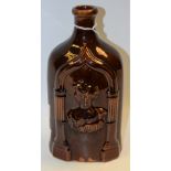 A 19th century style treacle glazed flask,