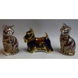 A Royal Crown Derby paperweight, Scottish Terrier, silver stopper; two others, Cats,