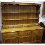 A large country oak dresser, shaped uprights,