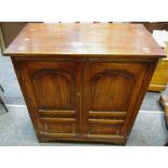 A Reprodux dark oak television cabinet,