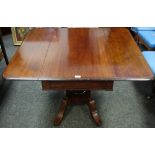 A George IV mahogany Pembroke table rounded rectangular moulded top, hidden drawer to frieze,