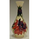 A contemporary Moorcroft pottery Ruby Red pattern spill vase, 16.
