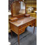 An Edwardian mahogany dressing table, arched bevel edge mirror,