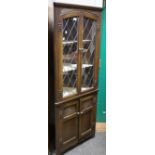 An oak dropleaf coffee table; an Old Charm floor standing oak corner cabinet,