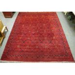 A large Middle Eastern hand woven carpet,