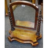 A Victorian mahogany dressing mirror, arched glass, bobbin turned up rights,