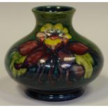 A Moorcroft pottery Columbine pattern squat vase, blue ground, 7.