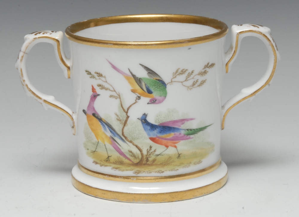 An early 19th century Chamberlain Worcester loving cup, well painted with exotic birds,