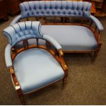 A Victorian spindle backed two seater sofa, button upholstered top rail, padded arms,