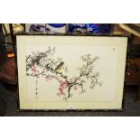 An oriental watercolour - a bird on a flowering branch, signed and framed.