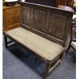 An oak settle, three panel back,