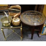 An oriental padouk wood occasional table carved with temple;