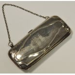 A silver evening purse with finger chain, leather lined, Birmingham 1912.