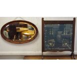 An early 20th century oak mirror,