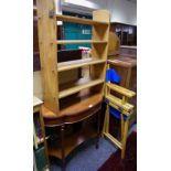 An oak open bookcase; bow framed mahogany hall table;