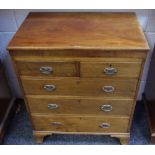 A small mahogany chest, oversailing top, two short drawers over three graduated long, swing handles,