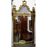 A contemporary Rocco style mirror,