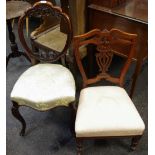 A Victorian mahogany balloon back salon chair, shaped and pierced back, padded over seat,