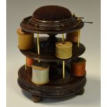 A Victorian mahogany two tier bobbin stand with velvet pin cushion circa 1860. 17cm high.