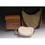 A lady's leather handbag, stamped Hermes, Paris; two others,