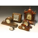 An early 20th century mahogany mantel clock of small proportions; an oak Napoleon hat mantel clock;