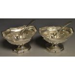 A pair of George III silver open table salts, of half fluted pedestal boat shape,