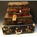 A Vintage suitcase with paper airline labels,