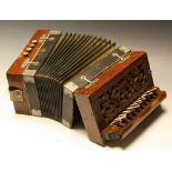 A rosewood accordion, mother-of-pearl keys, pierced carved soundboard with central lyre,