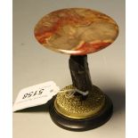 A dark and gilt-patinated bronze and specimen agate miniature table, figural urchin pedestal,