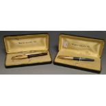 A Waterman pen with 14ct nib; another;