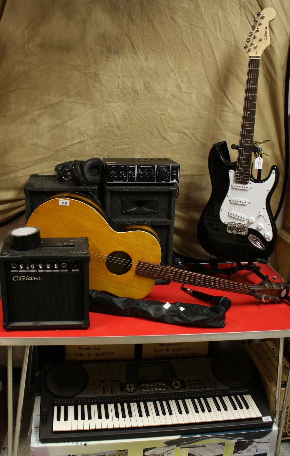Musical Instruments - a C-Giant electric guitar and amplifier; an acoustic guitar; a Casio keyboard,