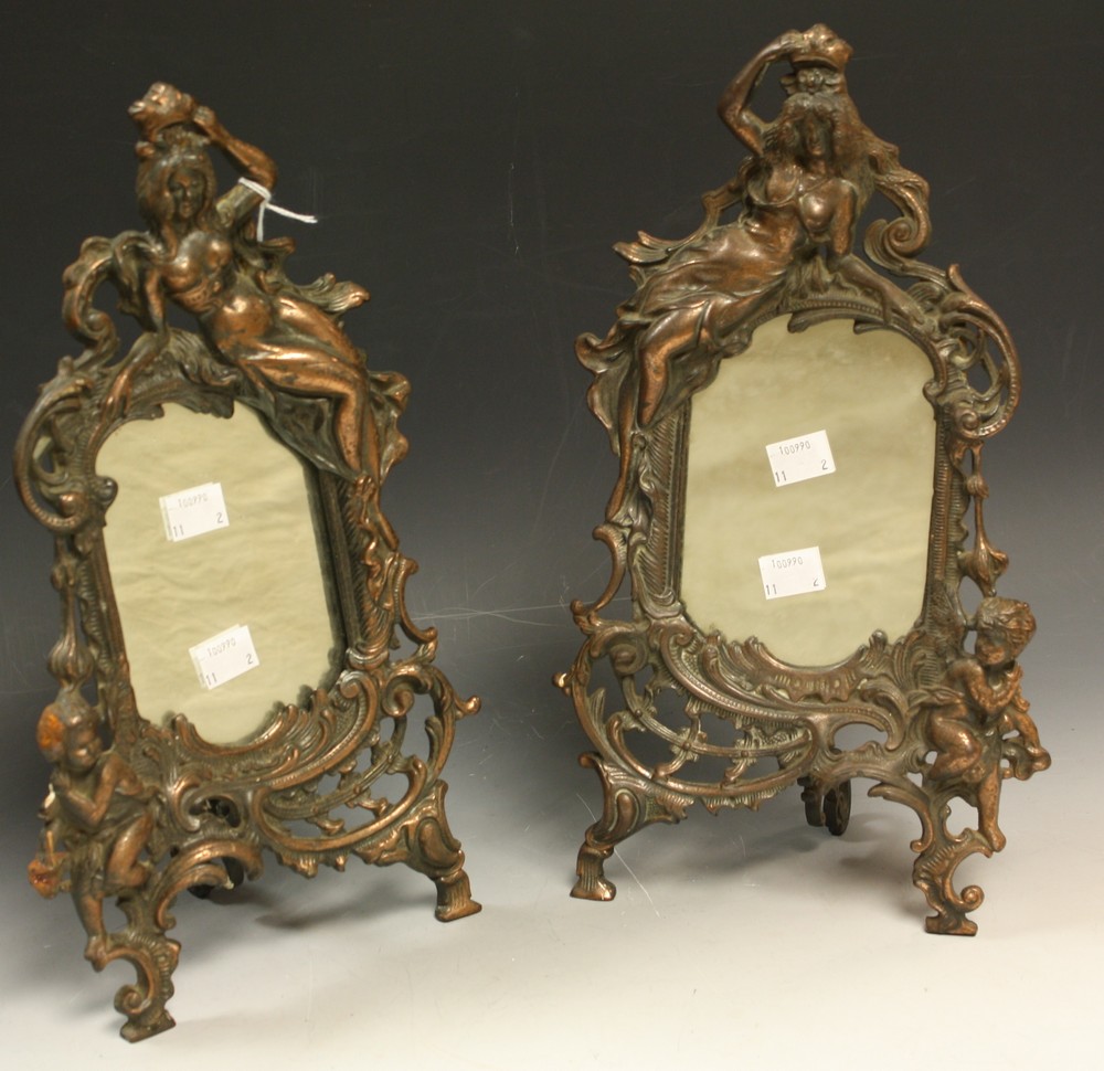 A pair of late 19th century design shaped rectangular table top easel mirrors,