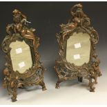 A pair of late 19th century design shaped rectangular table top easel mirrors,