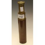 A brass three draw telescope, brown leather casing,