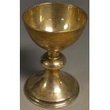 A silver communion chalice, knopped stem, spreading circular base, 10.