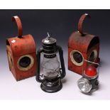 A pair of triple lens warning lanterns, red bodies, domed lenses, hook handles; others,