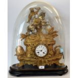 A gilt brass figural mantel clock, glass dome (faults),