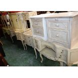 A harlequin selection of French style bedroom furniture comprising dressing tables, bedside chests,