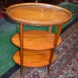 An Edwardian satinwood tray top oval butler's drinks table,