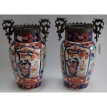 A pair of Japanese Imari patinated bronze-mounted porcelain baluster vases,