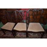 A set of four Chippendale Revival mahogany dining chairs comprising two side chairs and a pair of