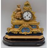 A late 19th century French gilt brass figural mantel clock, Bleu Celeste type porcelain panels,