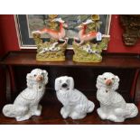 A pair of Victorian Staffordshire mantel dogs, 31cm high, c.