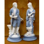 A pair of late 19th century Parian figural spill vases, in blue and white, 39cm high,