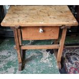 An unusual estate made pine work table, rectangular top above a deep frieze drawer,