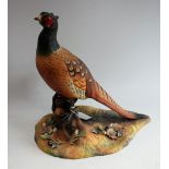 A Royal Crown Derby model, of a pheasant, naturalistically modelled, signed K Wood, 27cm high,