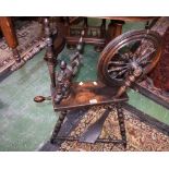 A 19th century spinning wheel, turned supports,