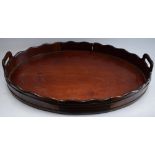 A 19th century Dutch mahogany oval gallery tray, shaped border, pierced carrying handles, 53cm wide,